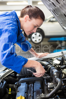 Mechanic working under the hood