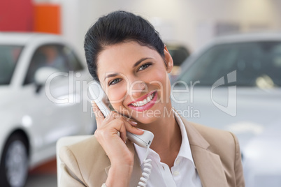 Smiling businessman making a phone call