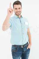 Delivery man pointing upward on white background