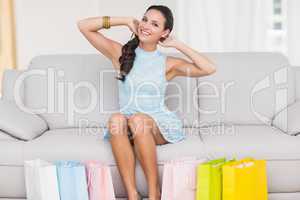 Stylish brunette with shopping bags