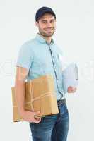 Portrait of happy courier man with parcel