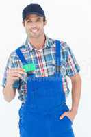 Confident plumber showing green card