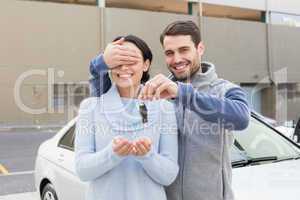 Young man about to surprise girlfriend with new car
