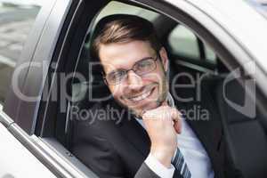 Happy businessman in the drivers seat