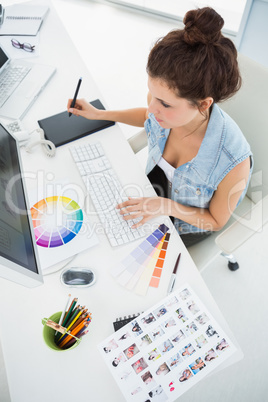 Designer working with colour wheel and digitizer