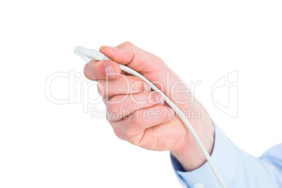 Businessman in shirt holding a cable