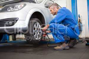 Mechanic adjusting the tire wheel