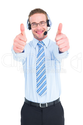 Positive businessman with handset and thumbs up