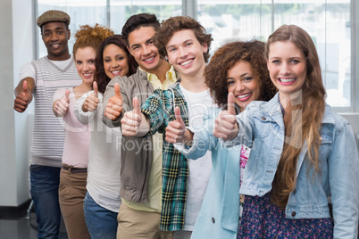 Fashion students smiling at camera together