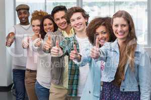 Fashion students smiling at camera together