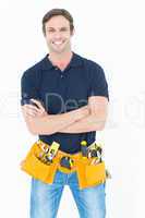 Confident man with tool belt around waist over white background