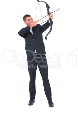 Businessman shooting a bow and arrow