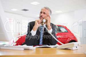 Upset businessman making a phone call