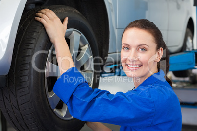 Mechanic adjusting the tire wheel