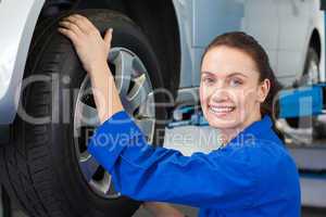 Mechanic adjusting the tire wheel