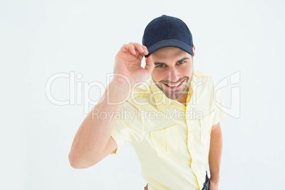 Handsome delivery man wearing baseball cap