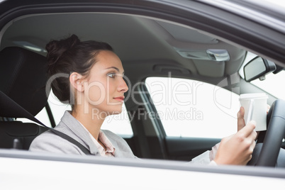 Young businesswoman having a coffee