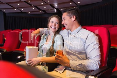 Young couple watching a film