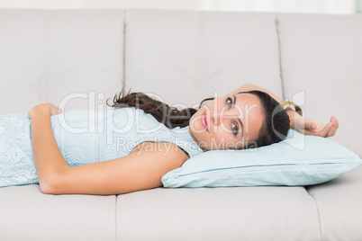 Pretty brunette relaxing on the couch