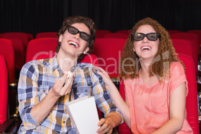 Young couple watching a 3d film