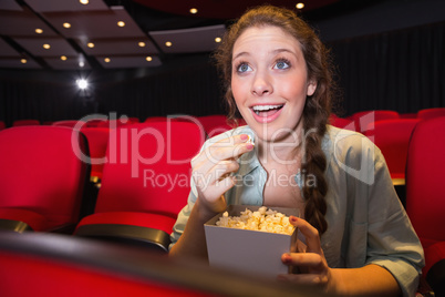 Young woman watching a film