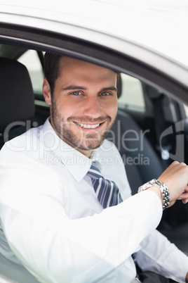 Young businessman in the drivers seat