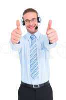 Positive businessman smiling with thumbs up