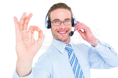 Businessman with headset making okay sign