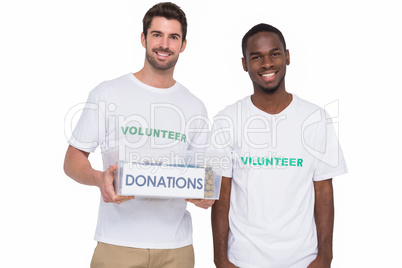 Portrait of smiling men participating at charity