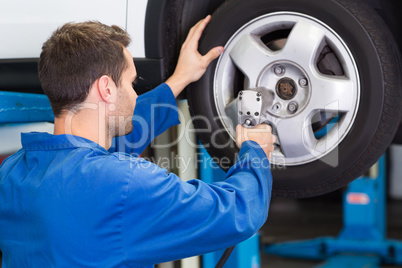 Mechanic adjusting the tire wheel