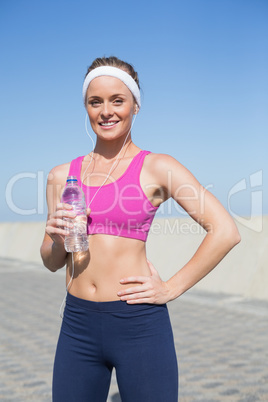 Fit blonde standing on the pier