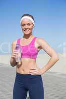 Fit blonde standing on the pier