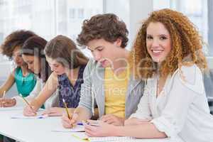 Fashion students taking notes in class