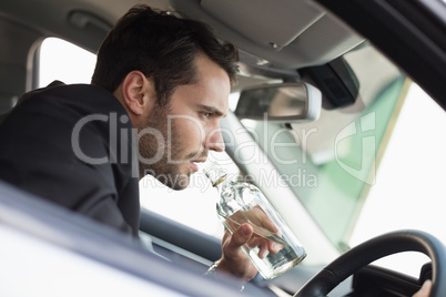 Young businessman driving while drunk