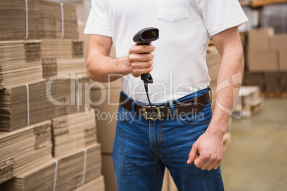 Close up of warehouse worker holding scanner