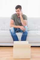 Casual man sitting in a sofa