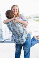 Attractive couple standing and hugging