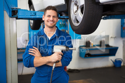 Mechanic holding a drill tool