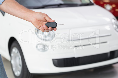 Close up of customer showing his new key