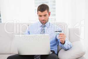 Businessman using his laptop