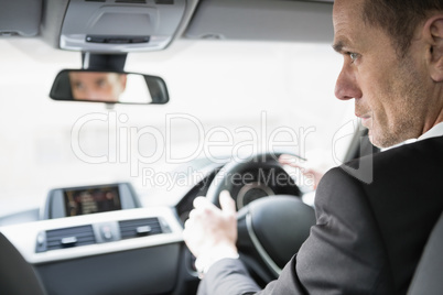 Businessman in the drivers seat