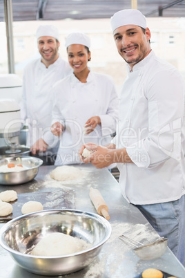 Team of bakers working at counter