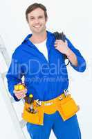 Electrician with wire roll and multimeter