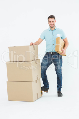 Courier man with cardboard boxes