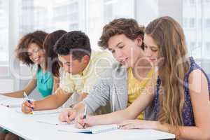 Fashion students taking notes in class