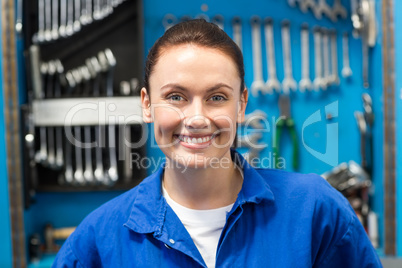 Smiling mechanic looking at camera