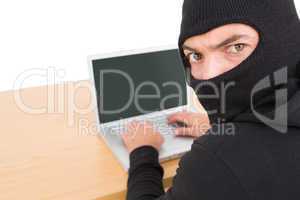 Hacker using laptop to steal identity