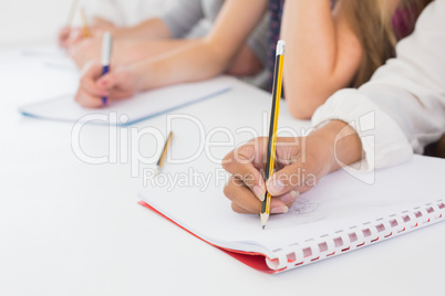 Students taking notes in class