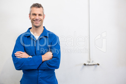 Mechanic smiling at the camera