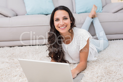 Pretty brunette using her laptop